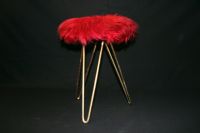 Vintage metal stool with red fur seating surface